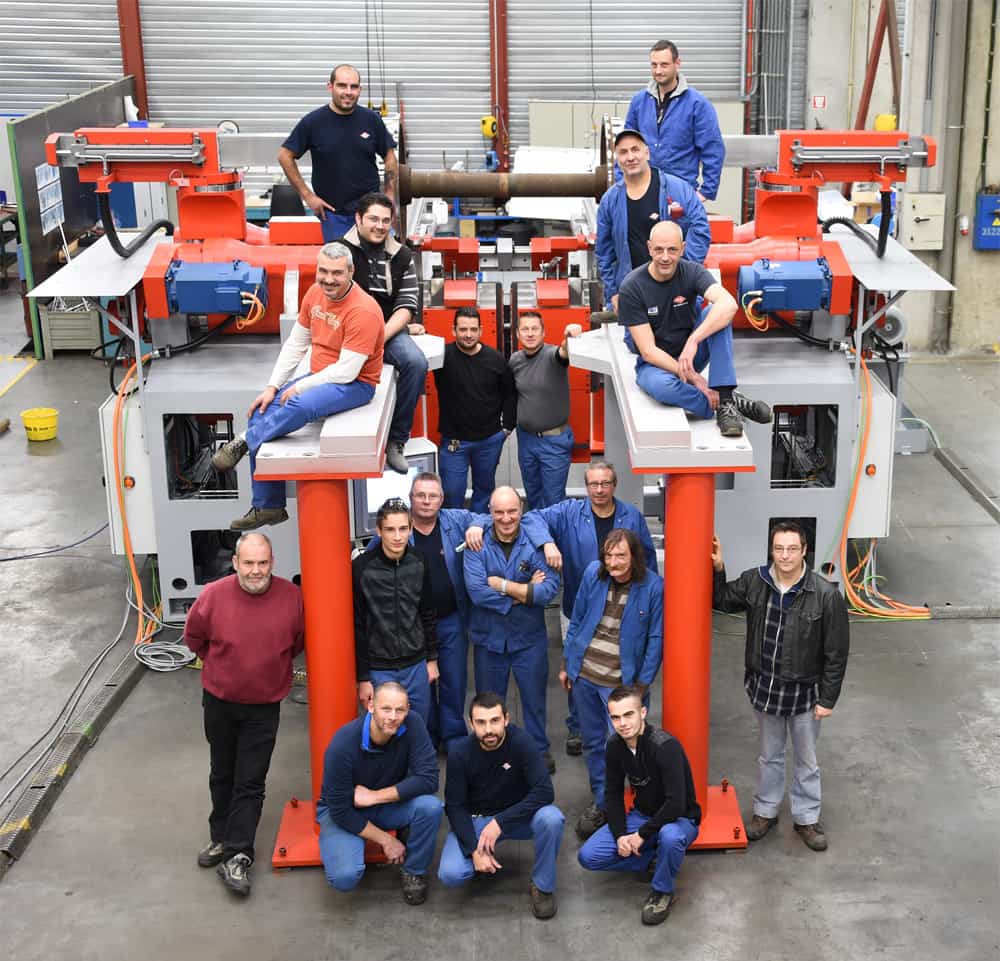PMC-Colinet team posing on a machine