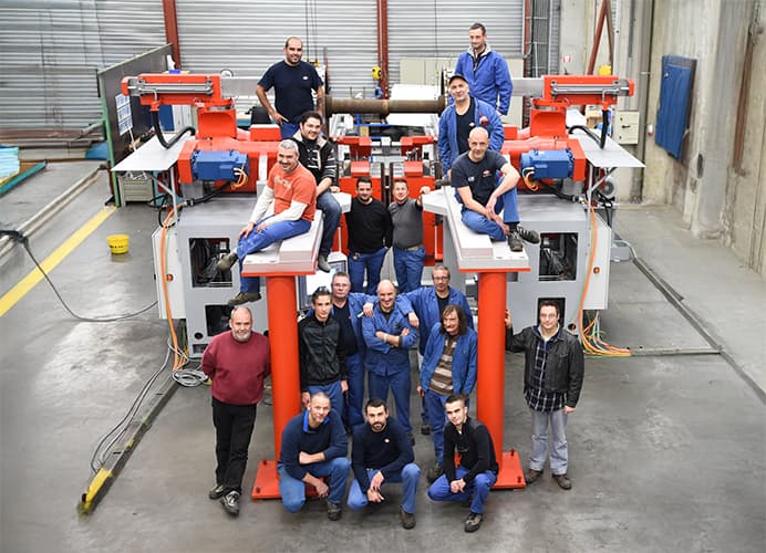 group of team members around machine